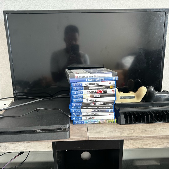 Sony PlayStation 4 Console with Games and 2 controllers - Black